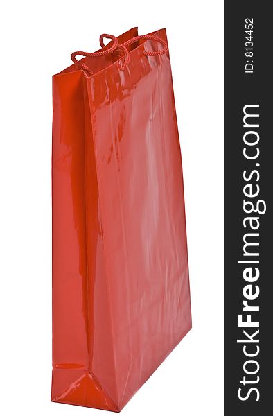 Red shopping bag isolated against a white background.