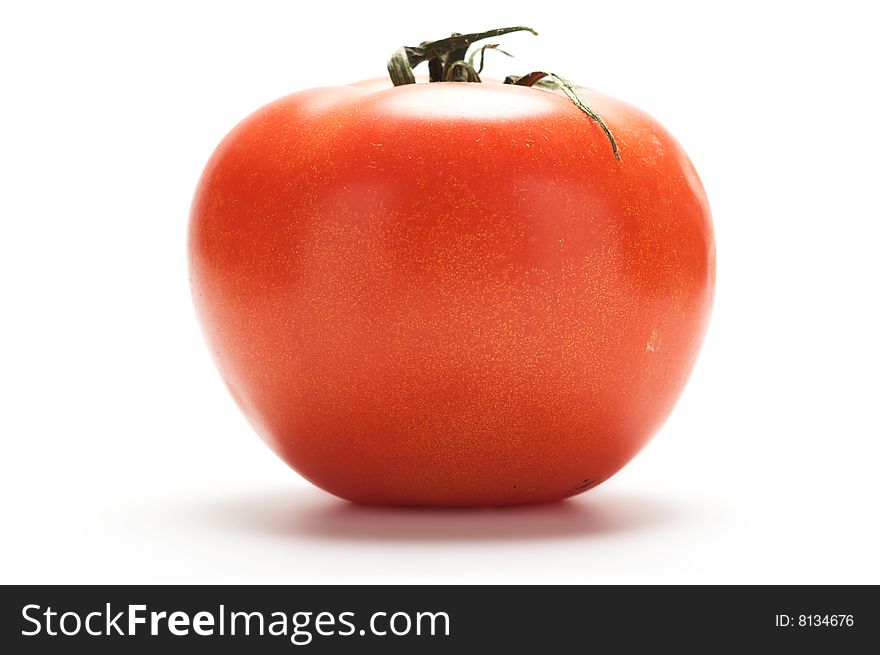 Large red tomato isolated on a white background.