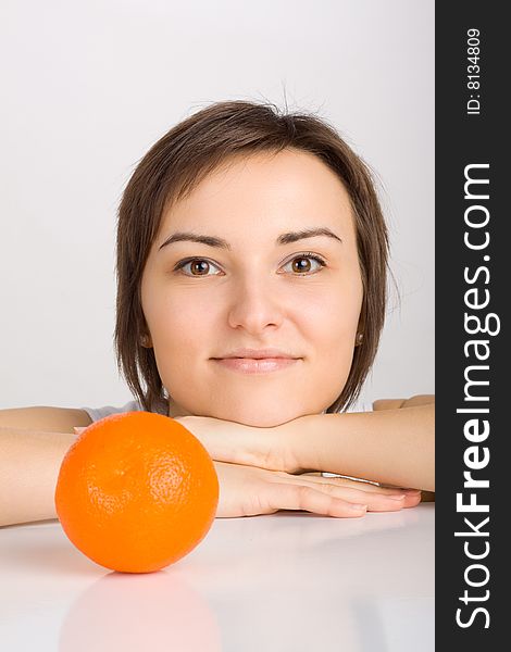 Girl with orange, shot in studio