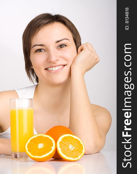 Girl with orange juice, shot in studio