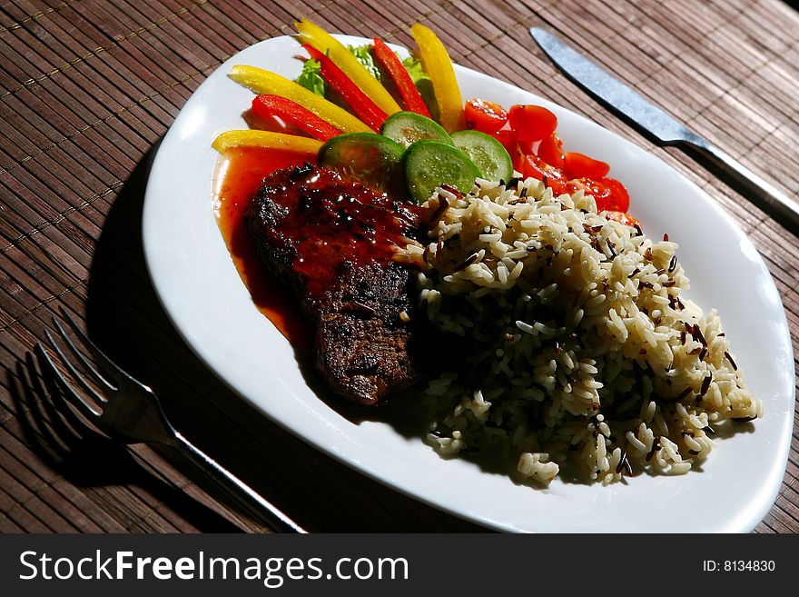 Garnish with fried meat and rice