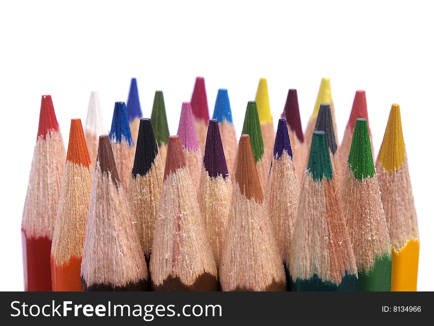 The ends of the sharpened color pencils isolated on white. The ends of the sharpened color pencils isolated on white