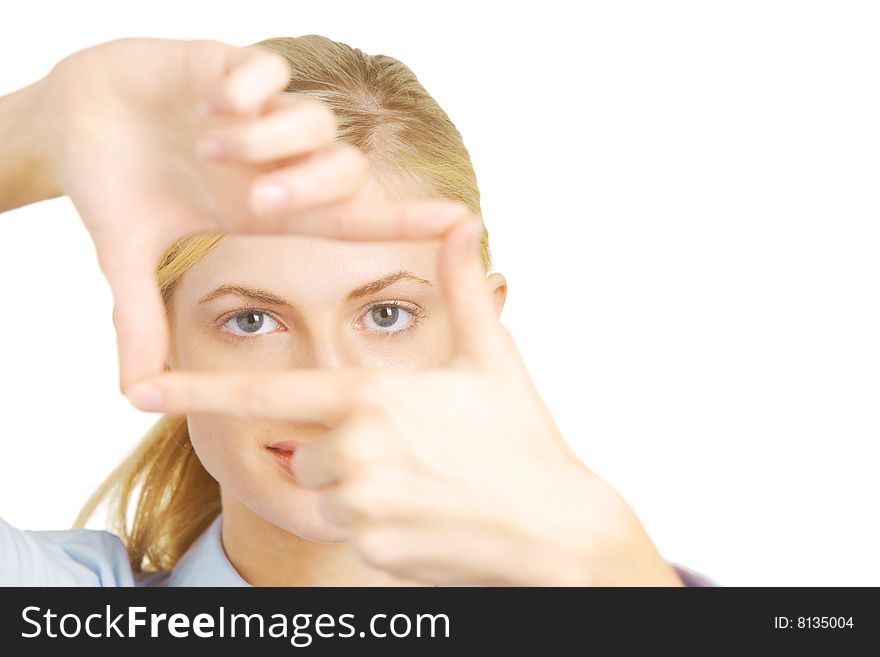 Business woman looking threw fingers in the studio