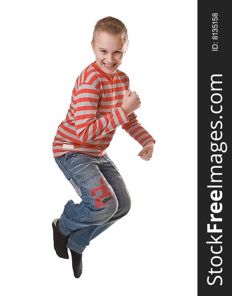 Young boy jumping isolated on a white background. Young boy jumping isolated on a white background