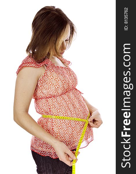 Studio photo of beauty pregnant woman with measuring tape