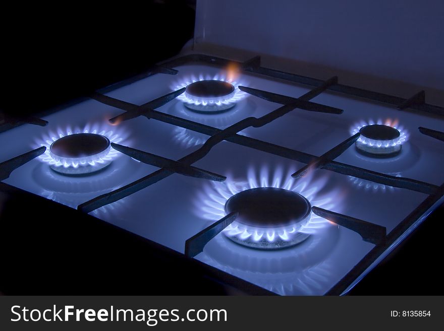 Flames of gas stove in the dark