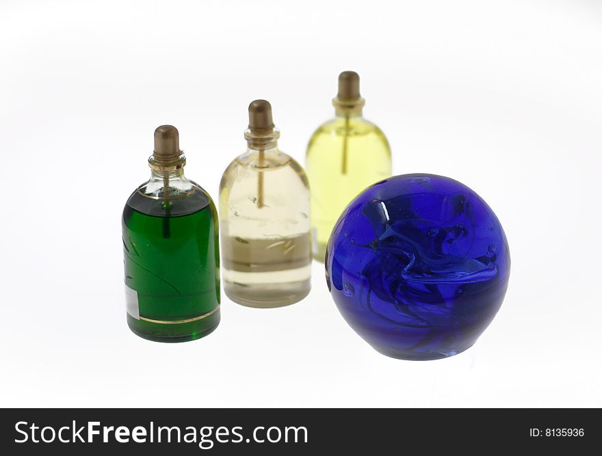 Multi-coloured bottles with oil  and sphere