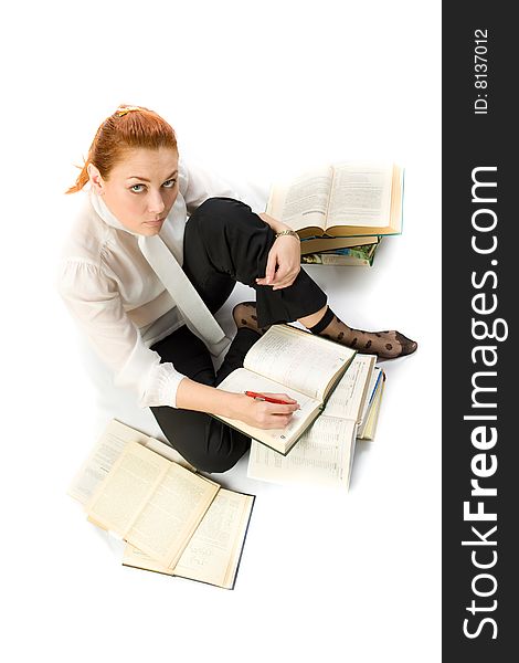 Woman Sitting On Floor With Books.