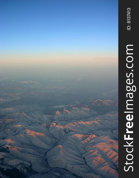A aerial view of mountains over Siberia with horizon. A aerial view of mountains over Siberia with horizon