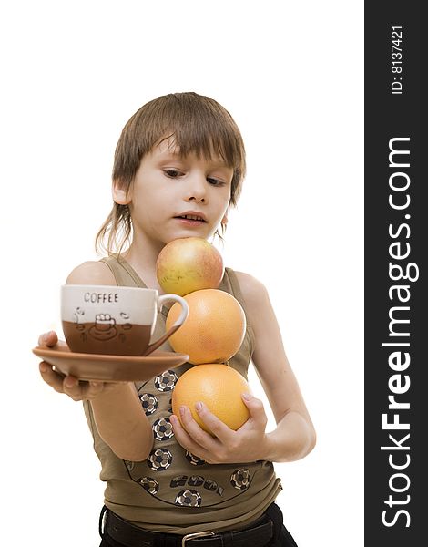 Young boy hold an apple and two grapefruits and cap of coffee. Young boy hold an apple and two grapefruits and cap of coffee