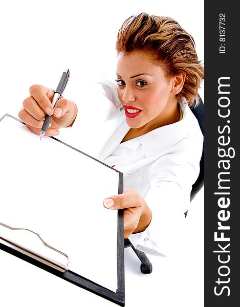 Female doctor writing on notepad on an isolated white background