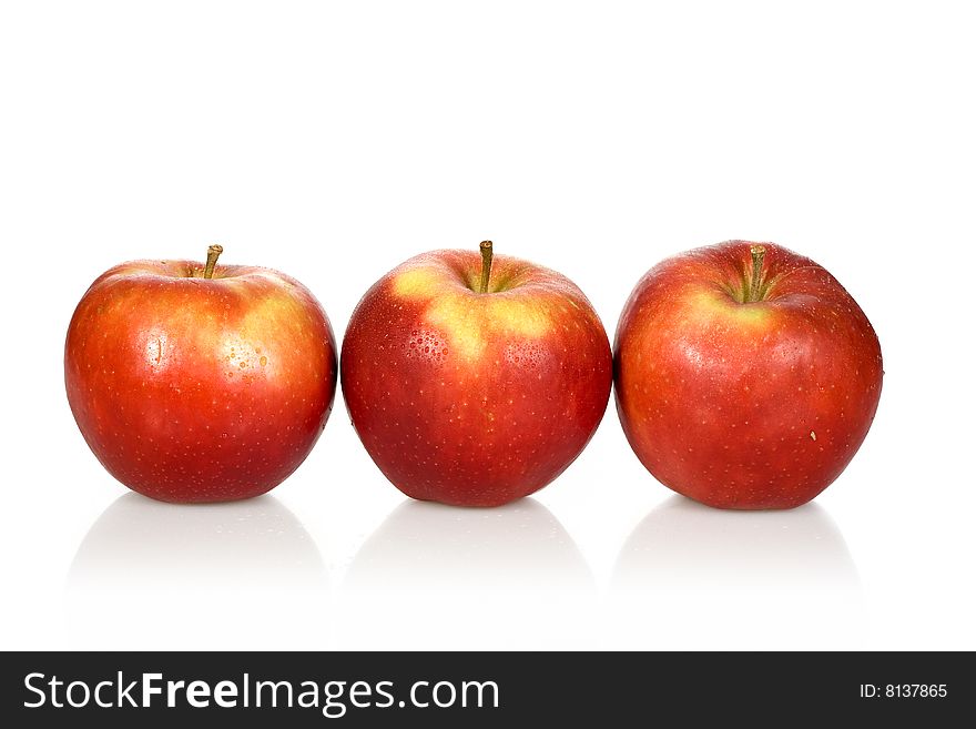 Three wet red apples on a white background - with clipping path