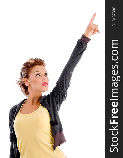 Side pose of young model against white background