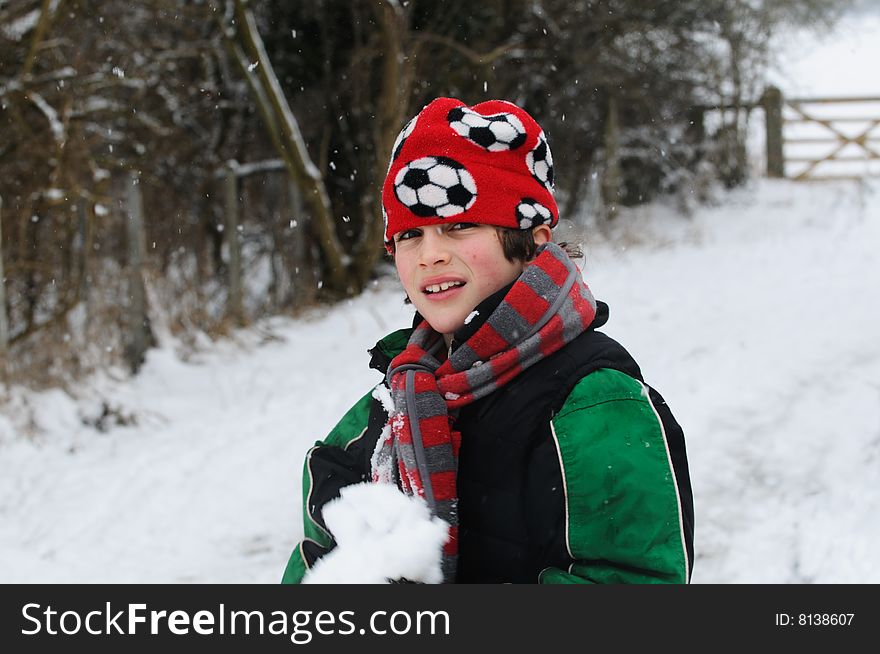 Boy playing in the snow