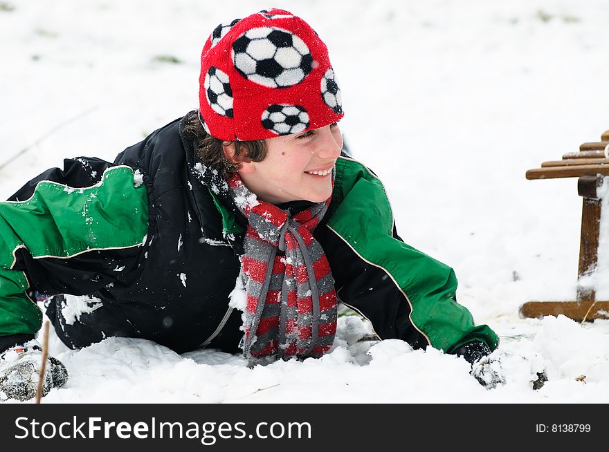 Boy falls in the snow
