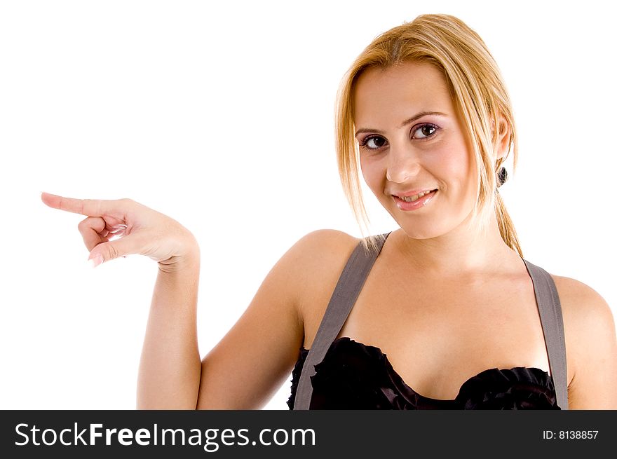 Woman pointing against white background