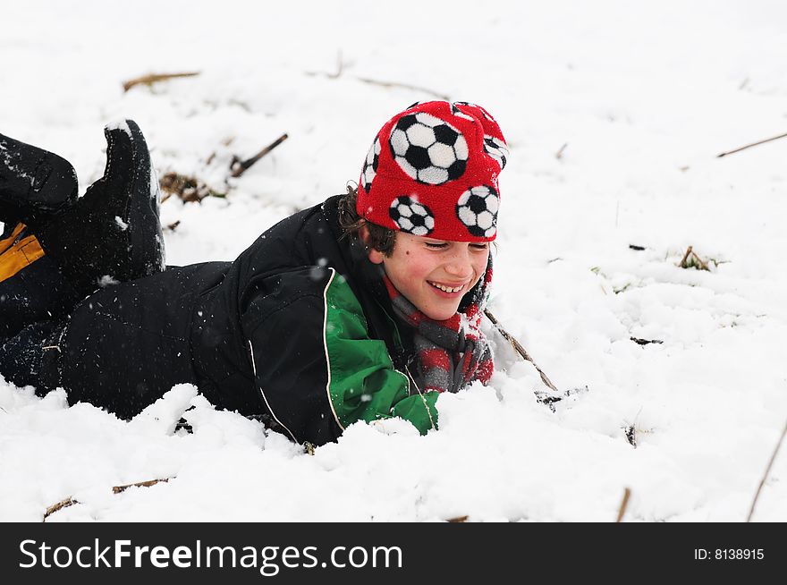 Portrait of boy fallen in the snow
