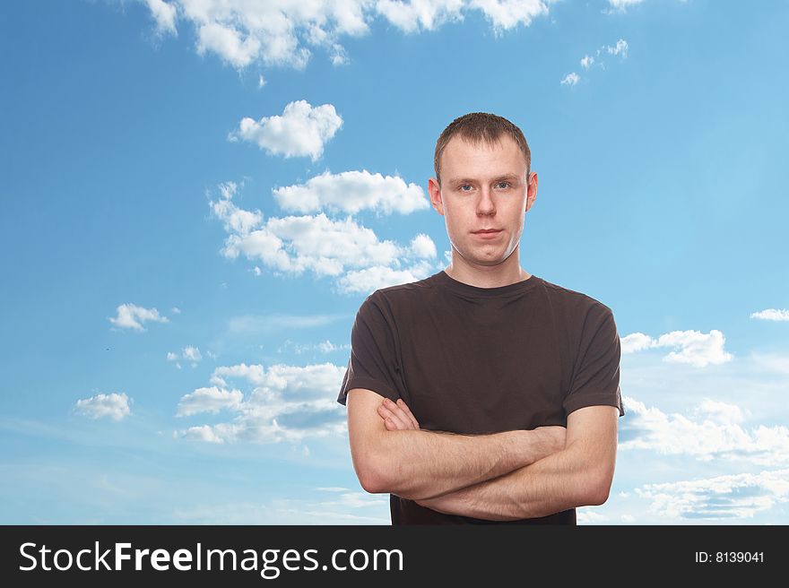 Thoughtful young man with blue sky