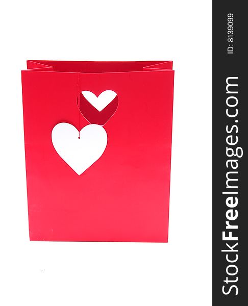 Shot of a red heart gift bag on white