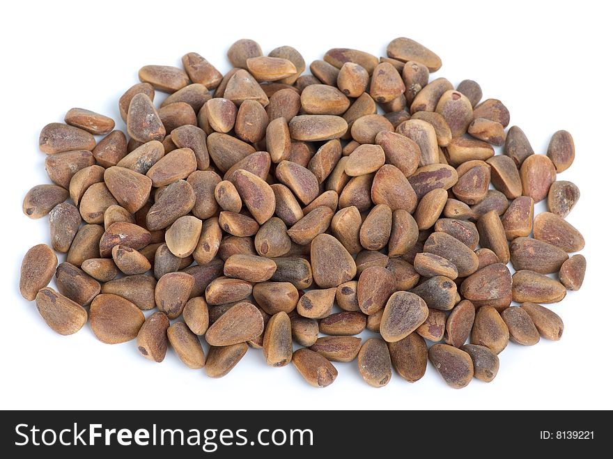 Pile of cedar nuts isolated on the white background