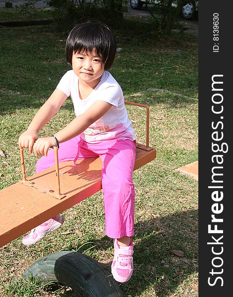 Girl on seesaw