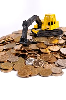 Yellow Excavator On A Big Heap Of Coins Royalty Free Stock Image Yellow Excavator On A Big Heap Of Coins Royalty Free Stock Image