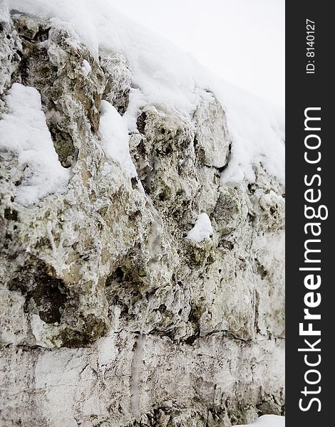 Stones covered with white snow. Stones covered with white snow