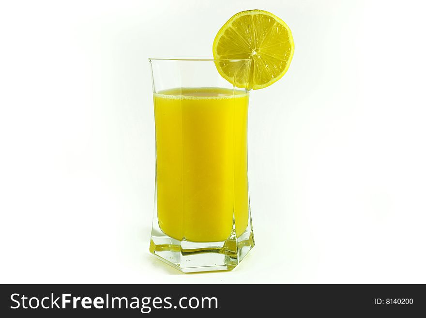 Fresh orange juice in glass and lemon cut. Fresh orange juice in glass and lemon cut