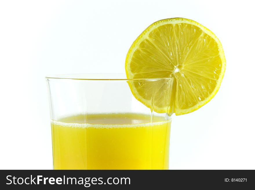 Orange juice in glass and lemon cut. Orange juice in glass and lemon cut