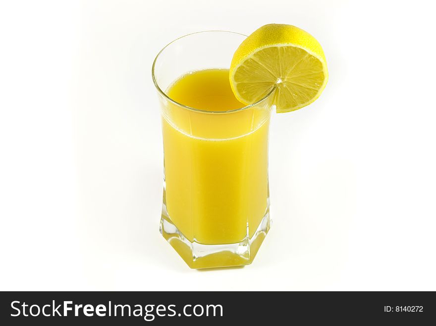 Fresh orange juice on glass with lemon