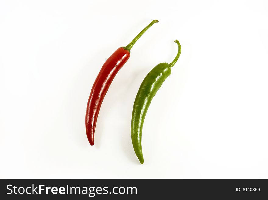 Red and green chillis on white background. Red and green chillis on white background
