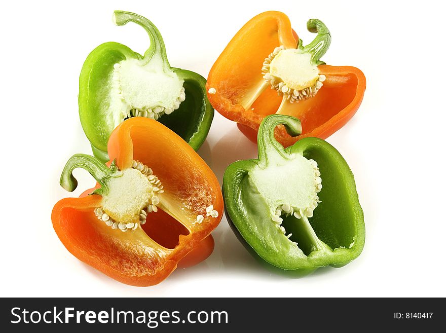 Capsicum pepper pieces on white background. Capsicum pepper pieces on white background