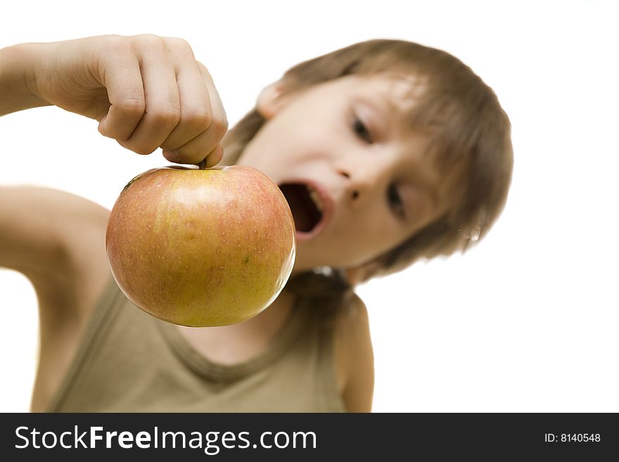 Young boy hold red apple in hand and open his mouth. Young boy hold red apple in hand and open his mouth