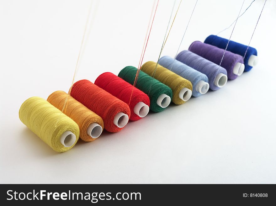 Reels of sewing threads of different colors for embroidery. Reels of sewing threads of different colors for embroidery
