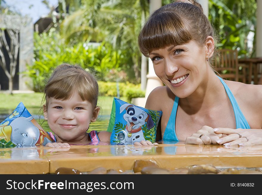 Portrait of young attractive woman having good time with her daughter. Portrait of young attractive woman having good time with her daughter