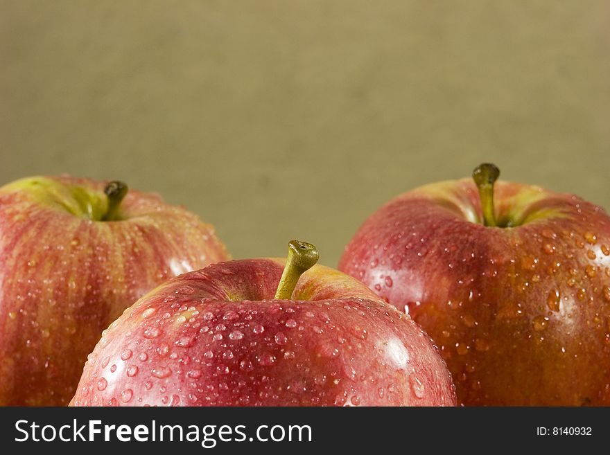 Red apples on water droplets. Red apples on water droplets