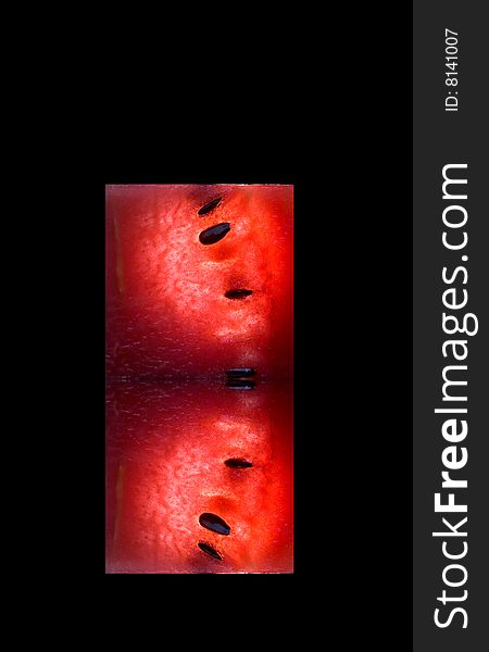 View of fresh watermelon slice on black back
