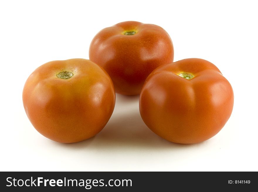 Red tomatoes on white background