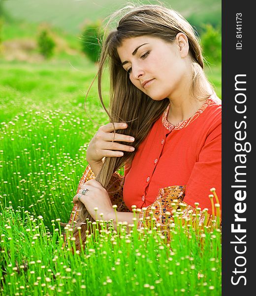 Beautiful young woman in green field. Beautiful young woman in green field