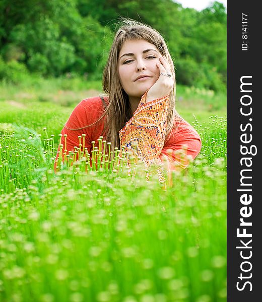 Beautiful young woman in green field. Beautiful young woman in green field