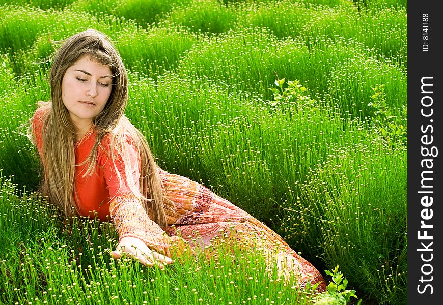 Beautiful young woman in green field. Beautiful young woman in green field