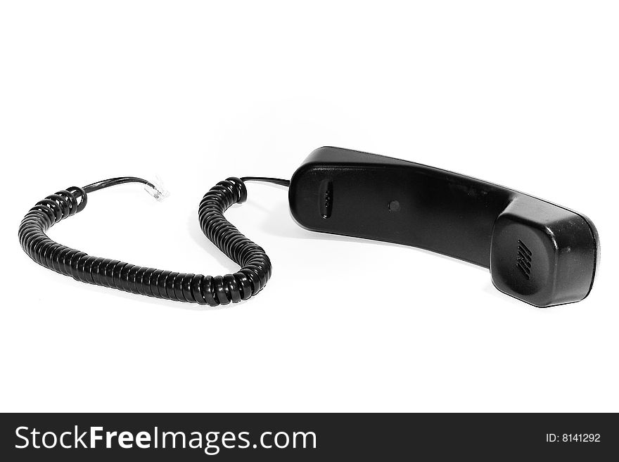 A telephone receiver isolated on white with soft shadow.
