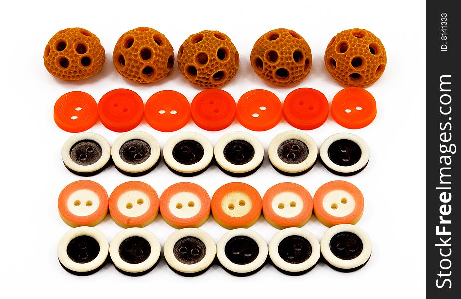 Rows of clothing buttons of different colors and shapes. Rows of clothing buttons of different colors and shapes