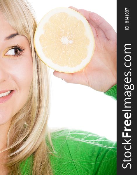 Attractive blonde woman with grapefruit on white