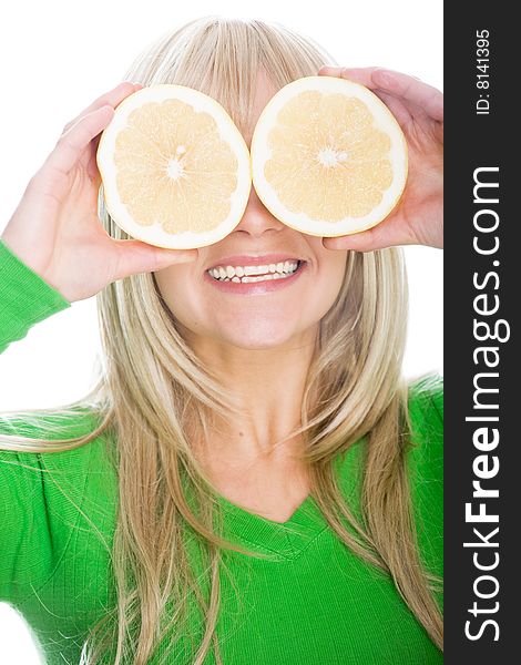 Attractive blonde woman with grapefruit on white