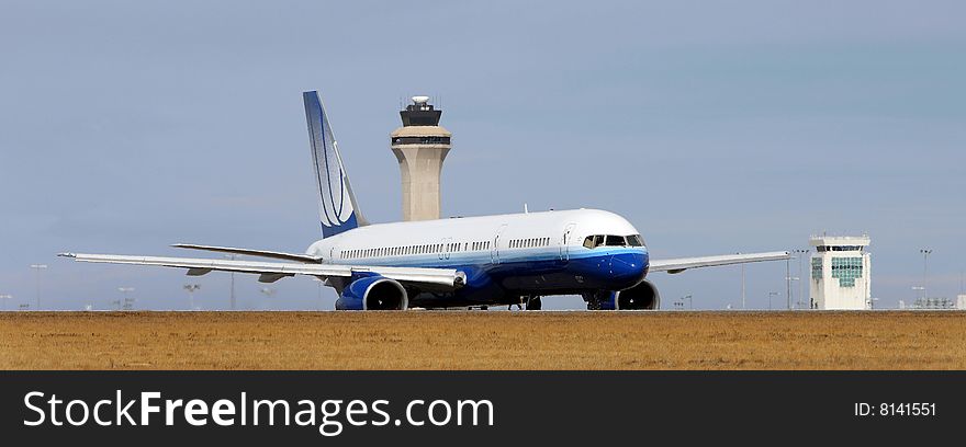 Side View Of Airplane On Runway