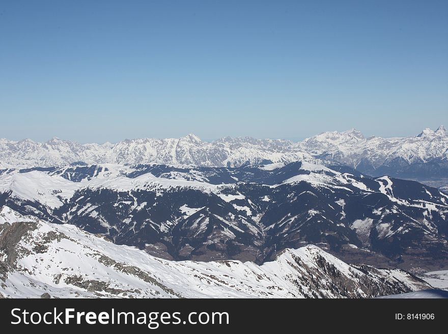 Austria. Mountains. The Alpes.Snow. The sun. Mountain tops.