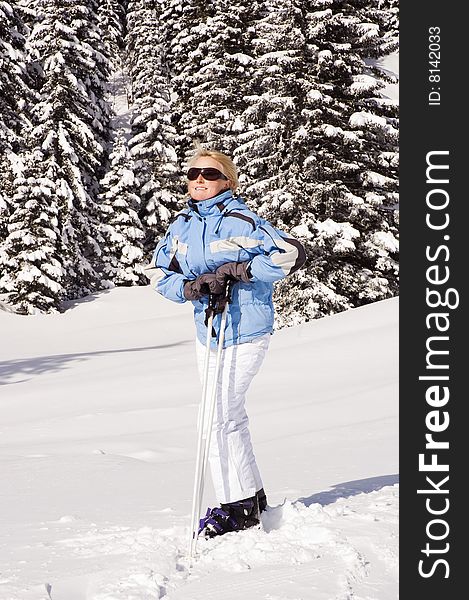 Young blond woman on fresh snow close up