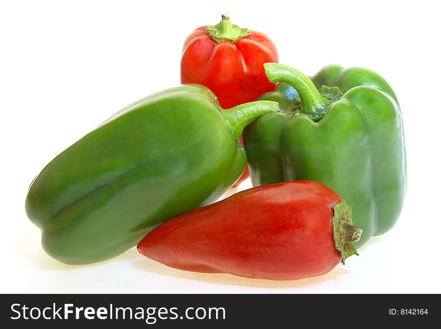 Red and green peppers white background isolated