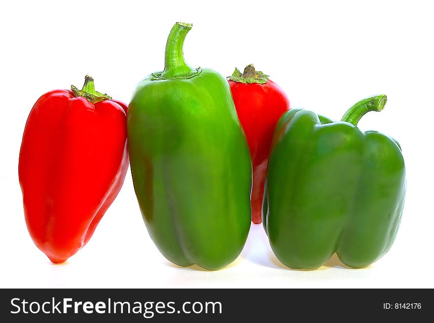 Red and green peppers white background isolated